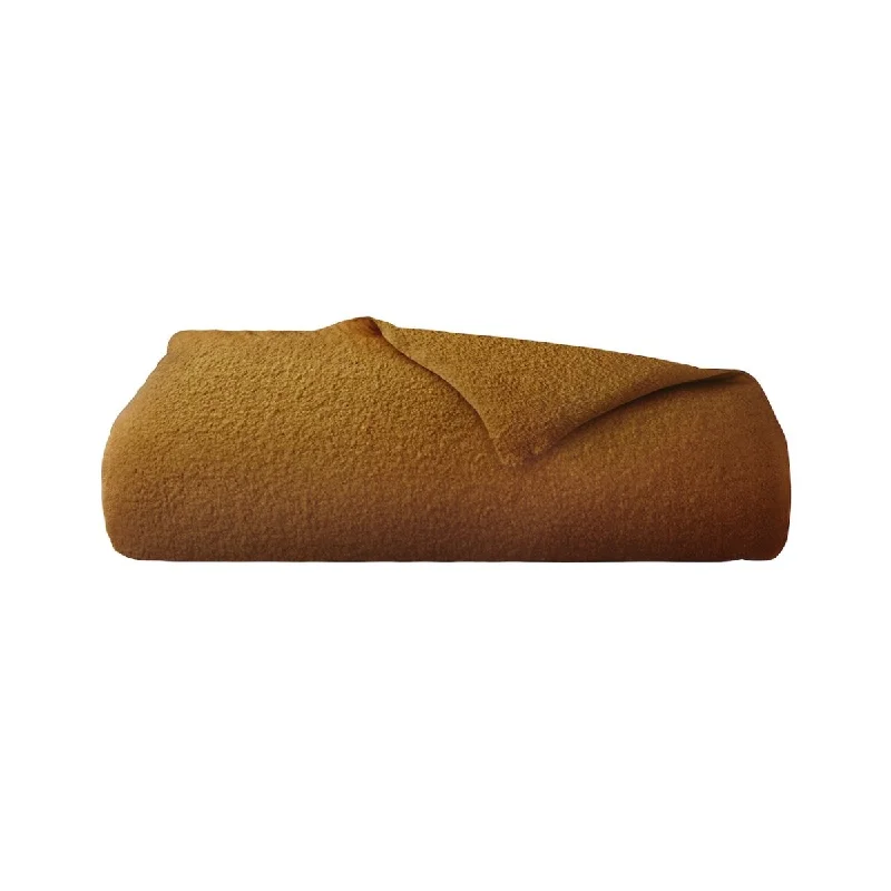 Silk blankets with a smooth and elegant touchLinen blankets with a rustic and textured lookBouclette Ocre Counterpane by Yves Delorme Silk blankets with a smooth and elegant touchLinen blankets with a rustic and textured lookBouclette Ocre Counterpane by Yves Delorme