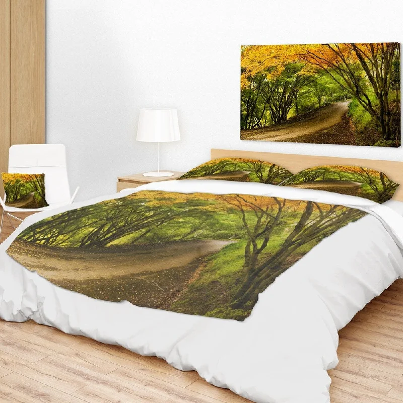 Cashmere blankets for ultimate softness and luxuryChenille blankets with a thick and fuzzy textureDesignart 'Country Lane in Green Forest' Landscape Fleece Throw Blanket