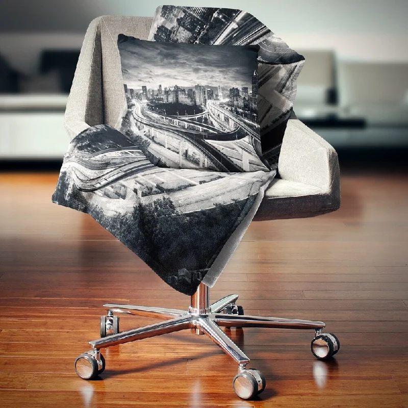 Silk blankets with a smooth and elegant touchMicrofiber blankets that are durable and easy to care forDesignart 'Dark Shanghai City' Cityscape Photography Throw Blanket