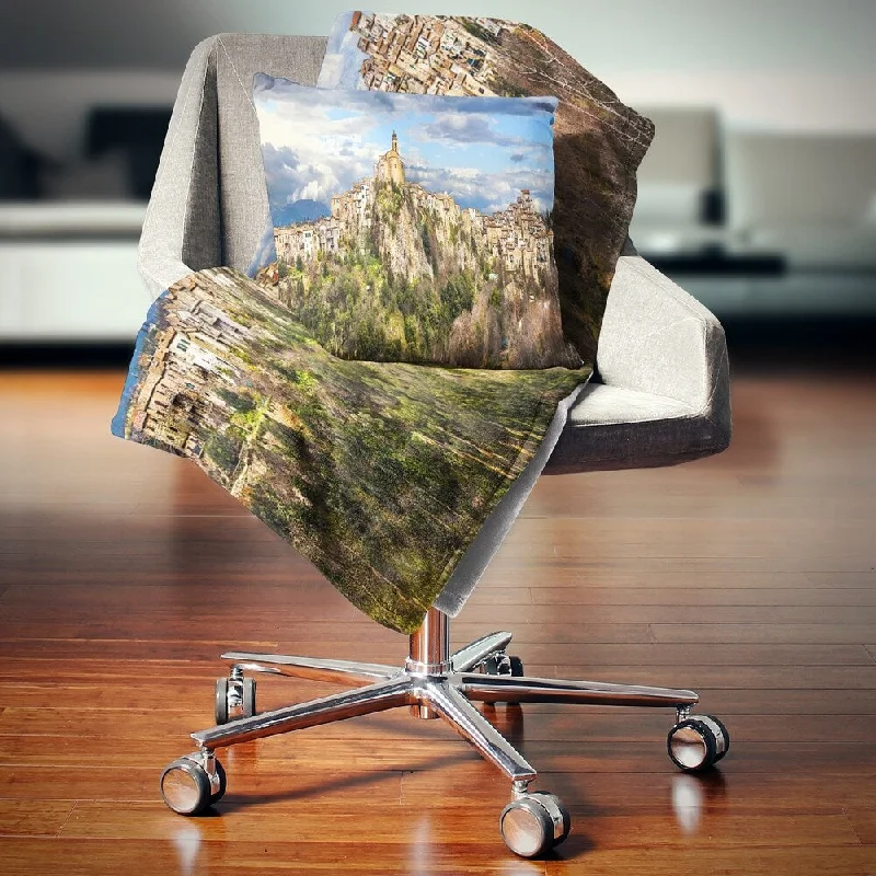 Rayon from bamboo blankets for a silky and breathable feelWool blankets with natural warmth and insulationDesignart 'Toffia Hilltop Village Italy' Landscape Fleece Throw Blanket