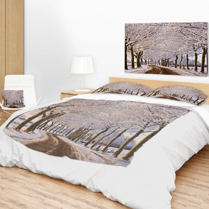 Synthetic fiber blend blankets for a budget - friendly choiceChenille blankets with a thick and fuzzy textureDesignart 'Trees And Road in White Winter' Landscape Fleece Throw Blanket