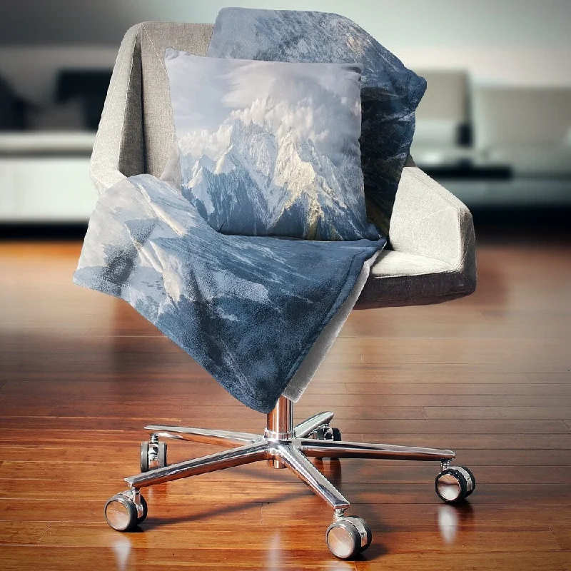 Microfiber blankets that are durable and easy to care forRayon from bamboo blankets for a silky and breathable feelDesignart 'Ushba Peak in Clouds' Landscape Photography Throw Blanket